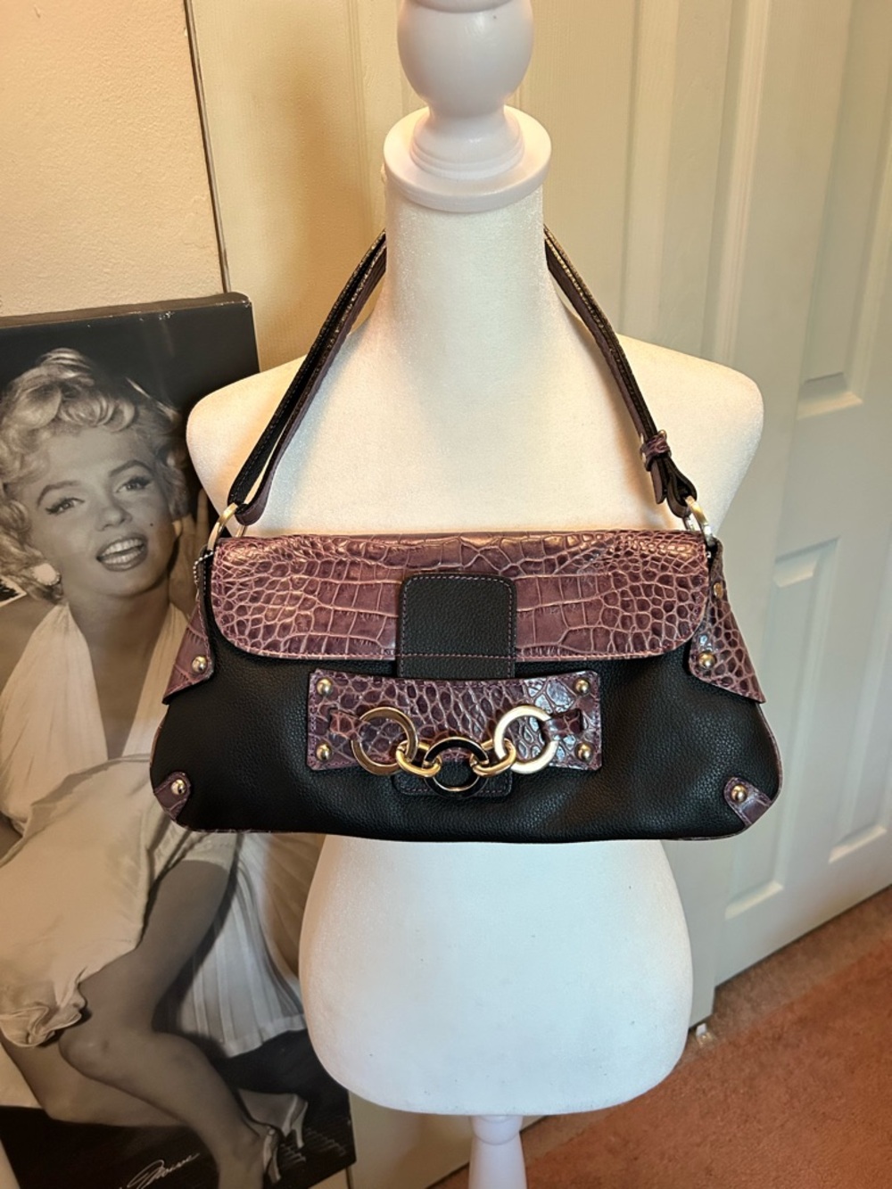 TK2 “i santi” leather black and deep purple crocodile accent bag.